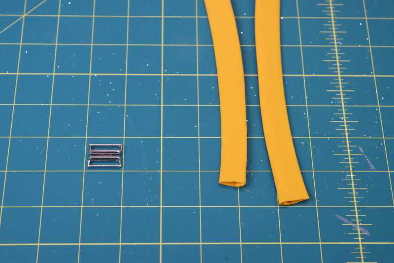 How To Flip Belt Tube Right Side Out - UV Protective Swimwear Tricot - Mood Fabrics - Amber Two Piece Cheeky Swimsuit Free Sewing Pattern Tutorial - MDF540 - Mood Fabrics Sewciety Blog - Flip the tube right sides out with a loop turner.