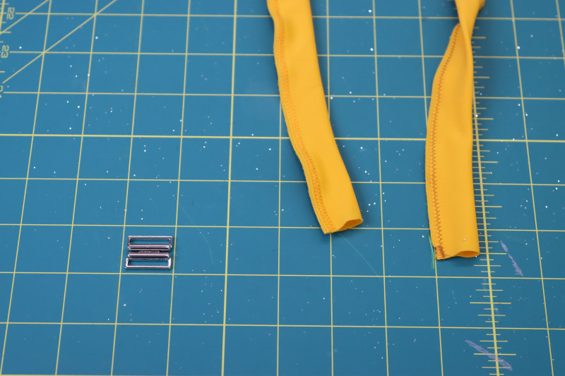 How To Sew Belt Fabric Tube - UV Protective Swimwear Tricot - Mood Fabrics - Amber Two Piece Cheeky Swimsuit Free Sewing Pattern Tutorial - MDF540 - Mood Fabrics Sewciety Blog - Sew the strip of fabric into a closed tube, right sides together.