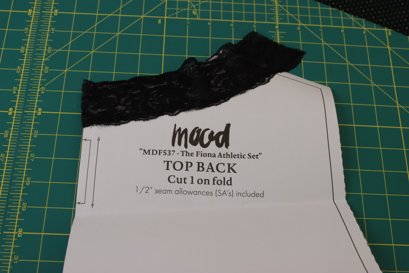 How To Cut Back Lace Collar - Stretch Lace Trim - Mood Fabrics - Fiona Athletic Set Free Sewing Pattern Tutorial - MDF537 - Mood Fabrics Sewciety Blog - Cut the back lace collar.