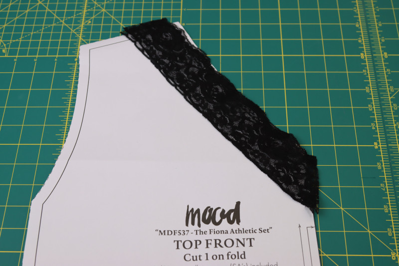 How To Cut Front Lace Collar - Stretch Lace Trim - Mood Fabrics - Fiona Athletic Set Free Sewing Pattern Tutorial - MDF537 - Mood Fabrics Sewciety Blog - Cut the front lace collar.