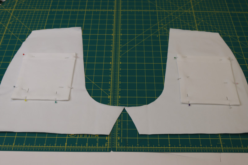 How To Pin Back Pockets Shorts Backs - Fleece Backed Stretch Cotton Knit - Mood Fabrics - Fiona Athletic Set Free Sewing Pattern Tutorial - MDF537 - Mood Fabrics Sewciety Blog - Pin the back pockets to the backs of the shorts.