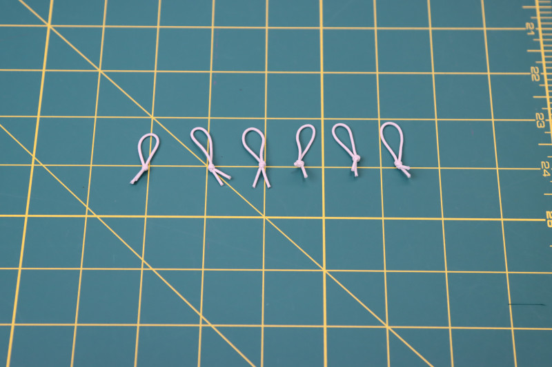 How To Tie Elastic Cord Loops - Elastic Beading Cord - Mood Fabrics - Fiona Athletic Set Free Sewing Pattern Tutorial - MDF537 - Mood Fabrics Sewciety Blog - Tie the elastic cord into loops.