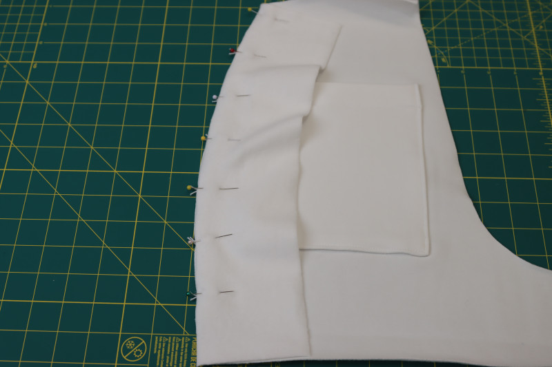 How To Pin Side Panels Back Side Seams - Fleece Backed Stretch Cotton Knit - Mood Fabrics - Fiona Athletic Set Free Sewing Pattern Tutorial - MDF537 - Mood Fabrics Sewciety Blog - Pin the side panels to the side seams of the backs of the shorts.