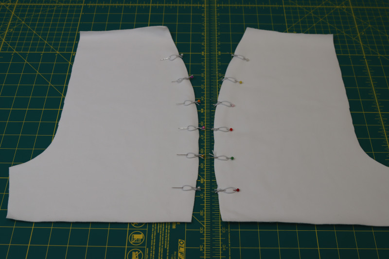 How To Pin Elastic Loops Front Side Seams - Elastic Beading Cord - Mood Fabrics - Fiona Athletic Set Free Sewing Pattern Tutorial - MDF537 - Mood Fabrics Sewciety Blog - Pin the loops to the right sides of the front shorts side seams.