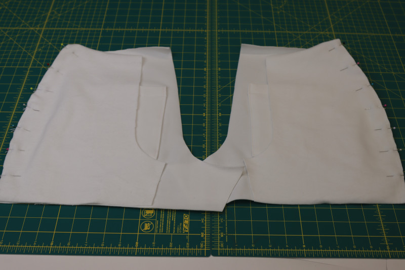 How To Pin Front Side Seams Side Panels - Fleece Backed Stretch Cotton Knit - Mood Fabrics - Fiona Athletic Set Free Sewing Pattern Tutorial - MDF537 - Mood Fabrics Sewciety Blog - Pin the front side seams of the shorts right sides together with the side panels.