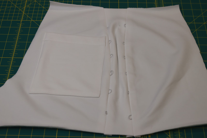 How To Press Front Side Seam Allowances - Fleece Backed Stretch Cotton Knit - Mood Fabrics - Fiona Athletic Set Free Sewing Pattern Tutorial - MDF537 - Mood Fabrics Sewciety Blog - Press the side seam allowances open and flat to reveal the elastic cord loops.