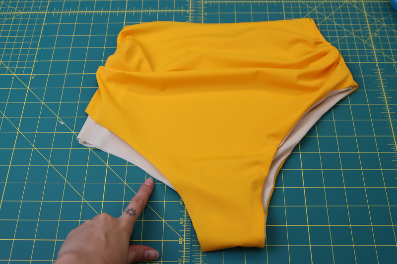 How To Flip Bikini Bottoms Other Leg Hole - UV Protective Swimwear Tricot - Mood Fabrics - Amber Two Piece Cheeky Swimsuit Free Sewing Pattern Tutorial - MDF540 - Mood Fabrics Sewciety Blog - Flip the bikini bottoms right sides out to do the other leg hole.