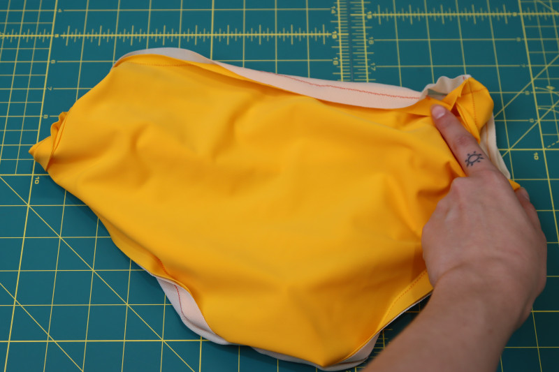 How To Sew Bikini Bottom Waistline Hole - UV Protective Swimwear Tricot - Mood Fabrics - Amber Two Piece Cheeky Swimsuit Free Sewing Pattern Tutorial - MDF540 - Mood Fabrics Sewciety Blog - Sew the waistline of the bottoms right sides together except for the small hole.