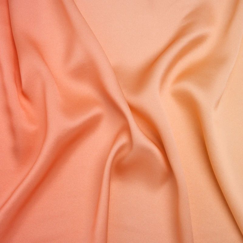 Silk Charmeuse Print 16MM, Made in Italy - Pale Peach to Blush Pink Ombre fabric perfect for Free Swimsuit Sewing Projects such as the Alexandrite Sunset Silk Charmeuse Slip Dress Sewing Pattern free PDF download from Mood Fabrics Sewciety Blog.