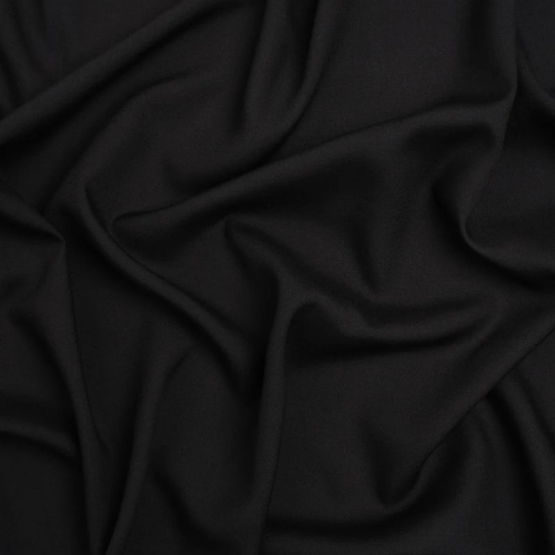 Medium-weight Rayon Batiste - Black - Loreto Collection fabric perfect for Free Swimsuit Sewing Projects such as the Tropea High Slit Slip Dress Sewing Pattern free PDF download from Mood Fabrics Sewciety Blog.