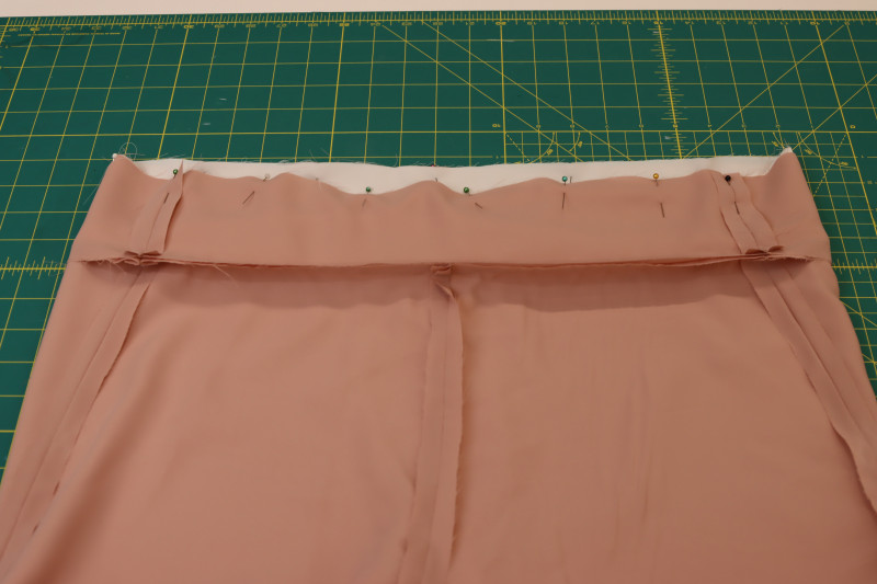 How To Pin Outer Inner Waistbands - White Polyester Double Georgette - Mood Fabrics - Ojai Reversive Wide Leg Pants Free Sewing Pattern Tutorial - MDF545 - Mood Fabrics Sewciety Blog - Pin the waistbands of the outer and inner pants right sides together.