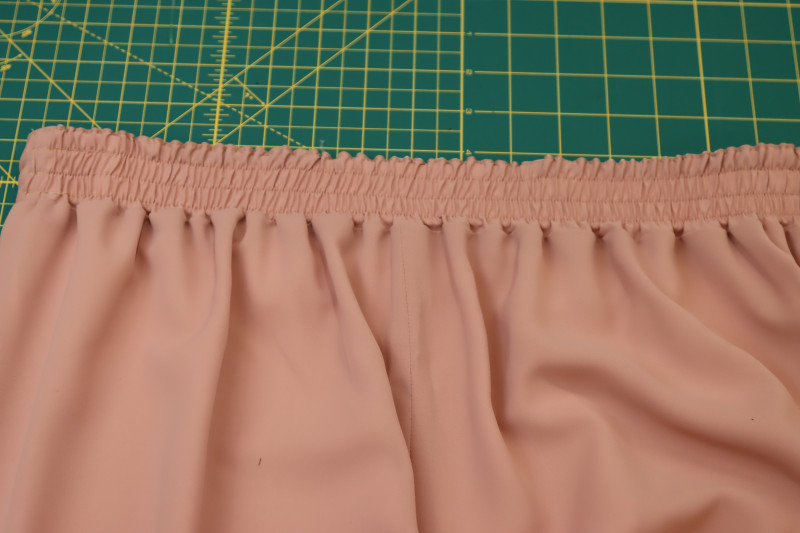 How To Sew Three Parallel Straight Stitches On Waistband - Gutermann Sew All Thread - Mood Fabrics - Ojai Reversive Wide Leg Pants Free Sewing Pattern Tutorial - MDF545 - Mood Fabrics Sewciety Blog - Sew three parallel top stitches while stretching the waistband.