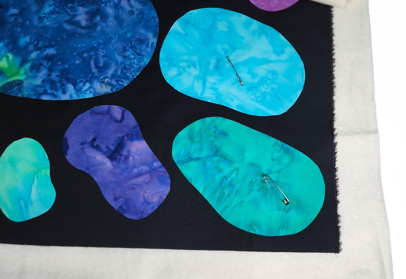 pinning the quilt layers together before sewing