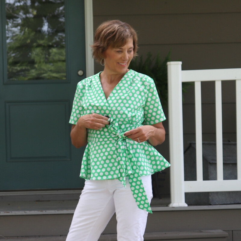Mood Fabrics' green polka dot poplin has the perfect hand for the bow and wrap for this McCall's 7892